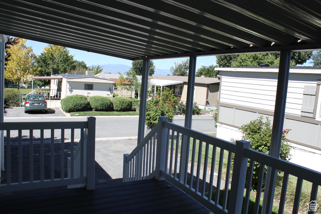 Wooden deck with a residential view