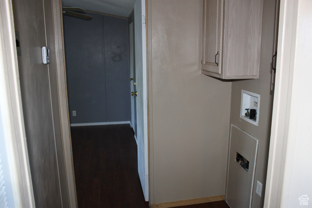 Laundry room with wood finished floors and washer hookup