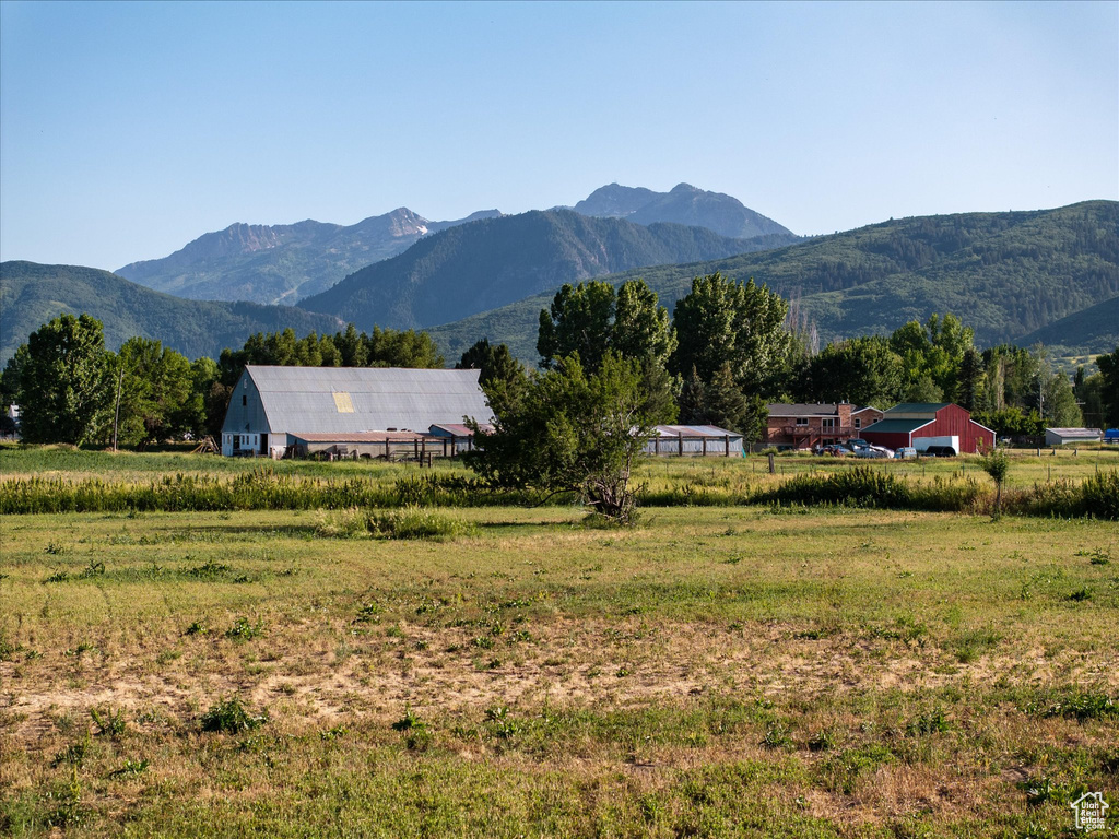 View of mountain backdrop with rural landscape