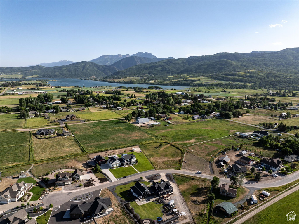 Aerial view of property's location featuring a water and mountain view