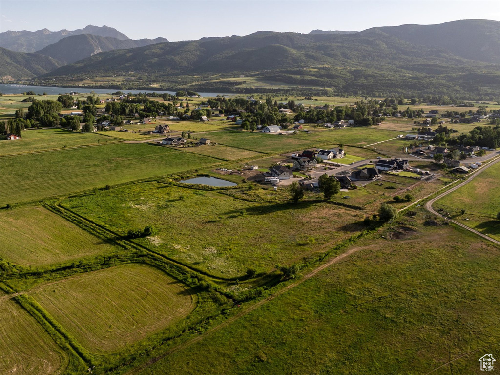 Aerial overview of property's location with a water and mountain view and rural landscape