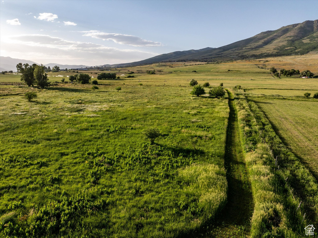 View of mountain backdrop featuring rural landscape