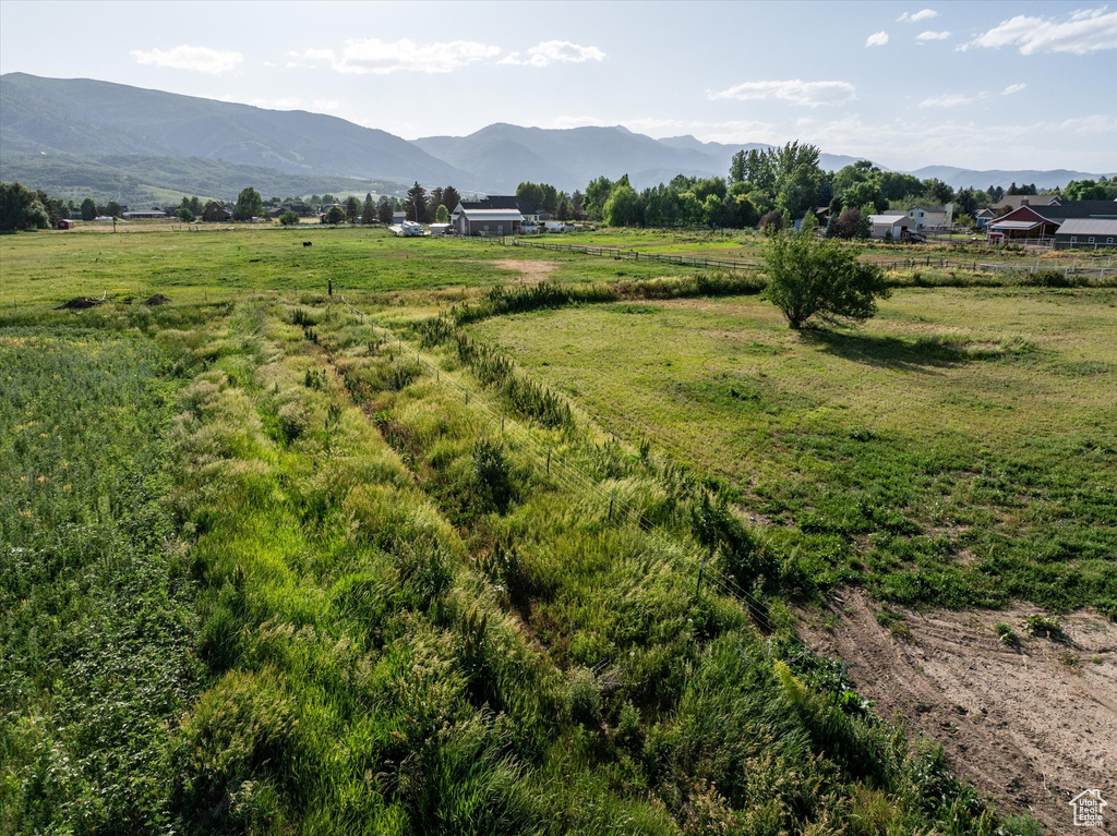 View of mountain backdrop featuring rural landscape
