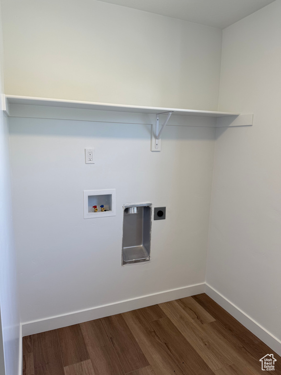Laundry room with dark wood-style flooring, hookup for a washing machine, and hookup for an electric dryer