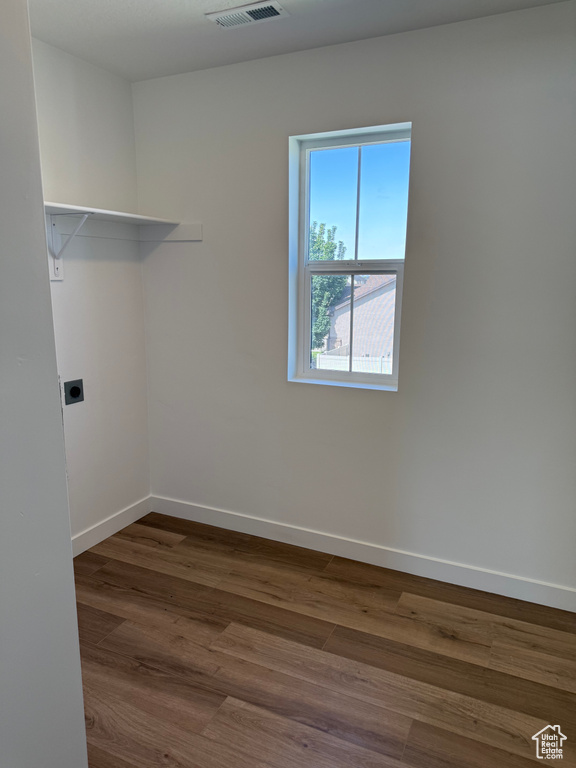 Washroom featuring hookup for an electric dryer and dark wood-style flooring