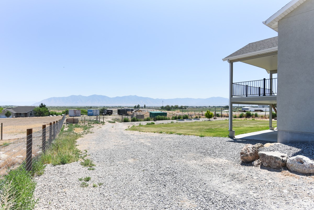 View of dirt / gravel road featuring a mountain view