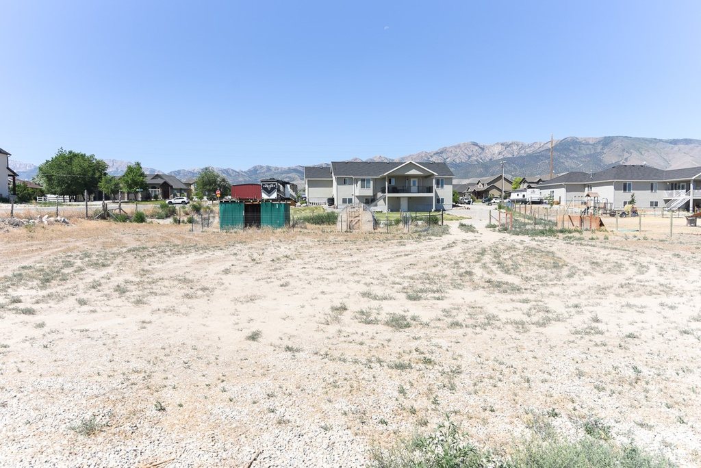 View of yard featuring a residential view and a mountain view