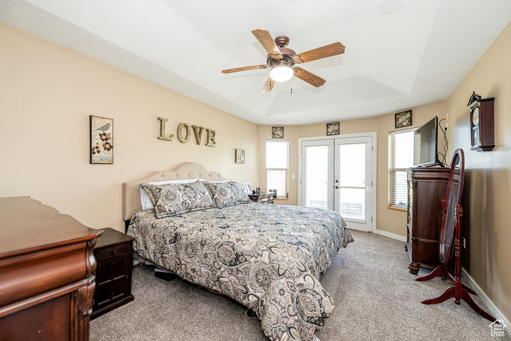 Bedroom with carpet floors, access to exterior, and ceiling fan