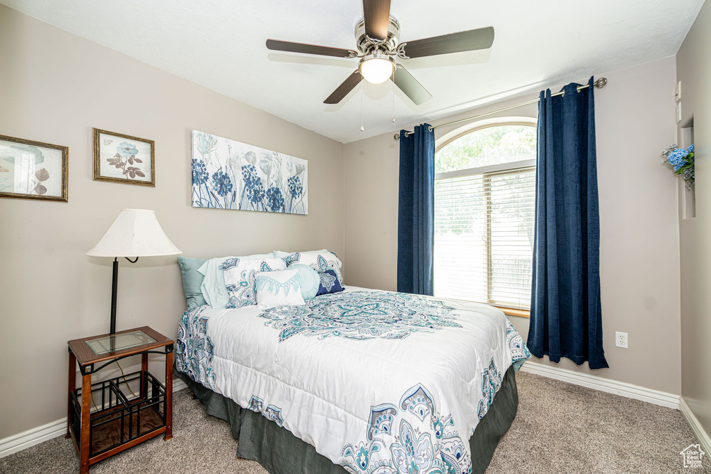 Bedroom featuring carpet and a ceiling fan