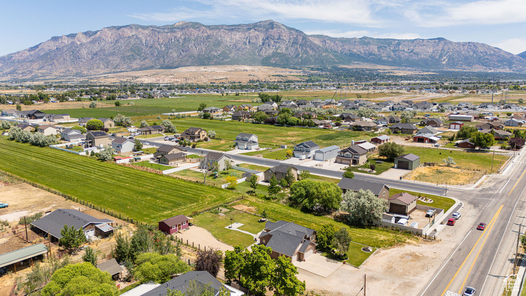 Aerial view of residential area featuring a mountainous background