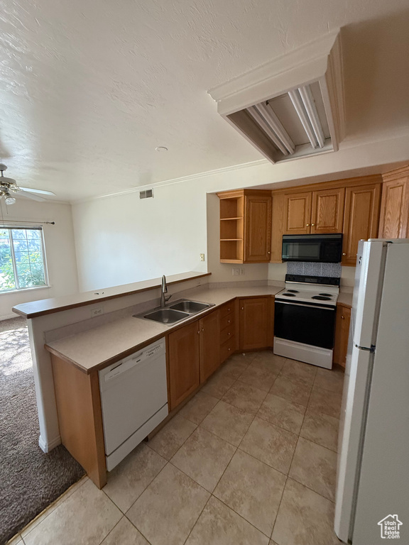 Kitchen featuring white appliances, a peninsula, open shelves, ceiling fan, and light tile patterned floors