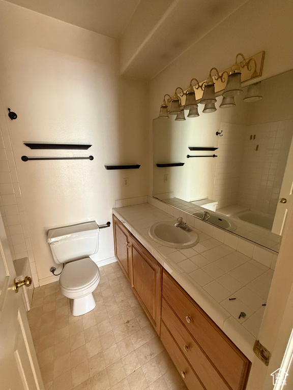 Bathroom with vanity, a shower, and a tub