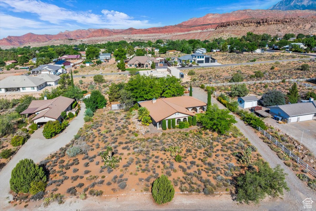Aerial view of residential area with a mountainous background