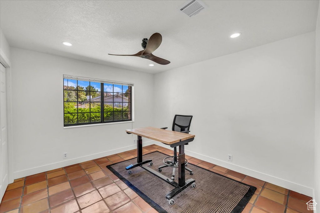 Unfurnished office featuring ceiling fan, tile patterned floors, and recessed lighting