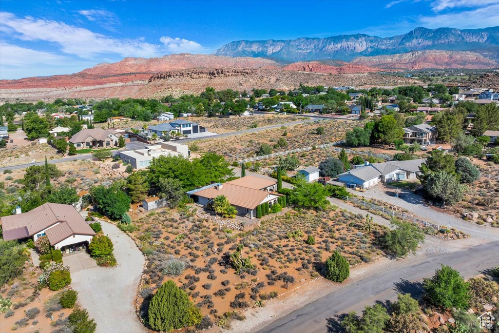 Aerial perspective of suburban area with a mountainous background