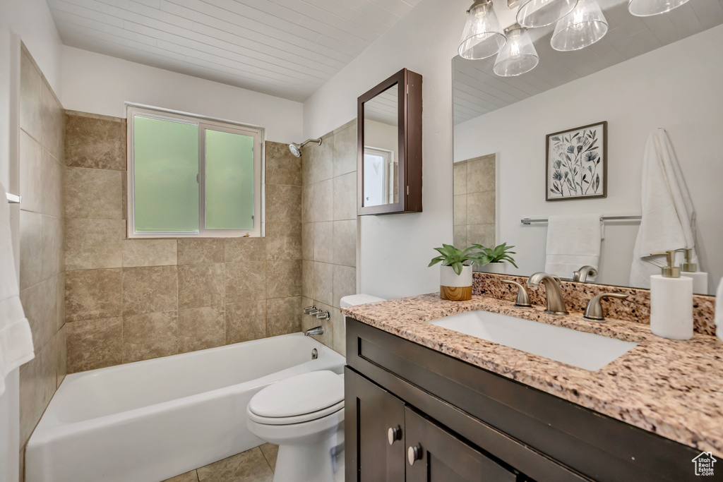 Full bathroom with vanity, shower / bath combination, and tile patterned flooring
