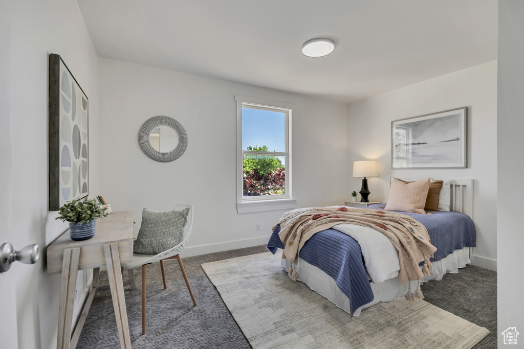 Bedroom with carpet and baseboards