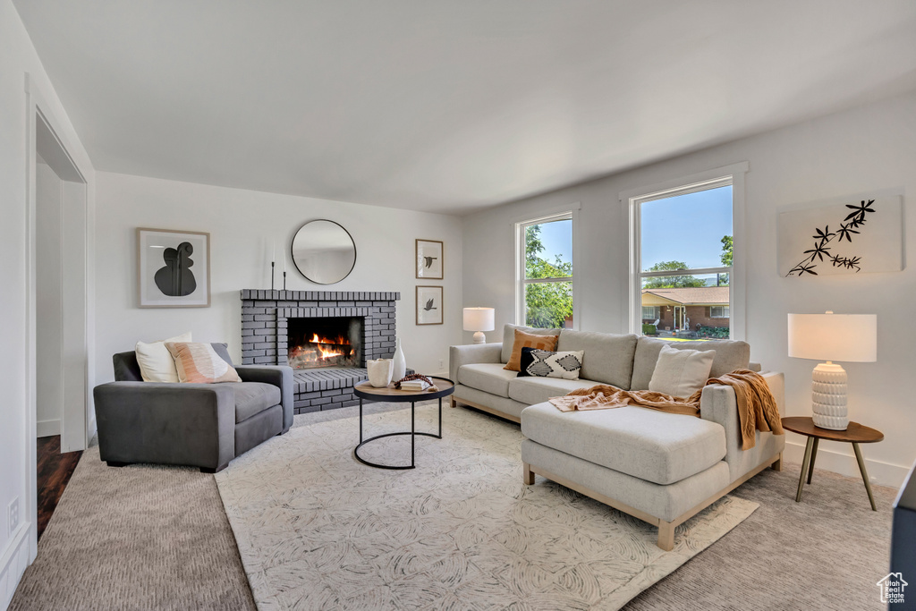 Living room with a fireplace and baseboards