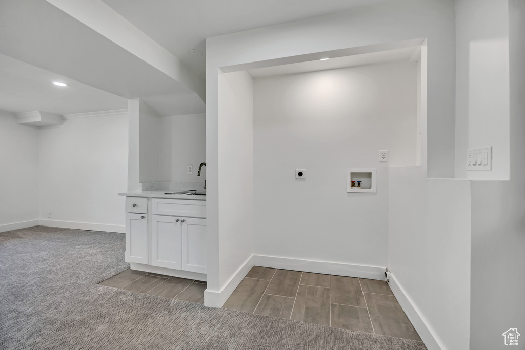 Washroom featuring hookup for an electric dryer, hookup for a washing machine, recessed lighting, and wood finished floors