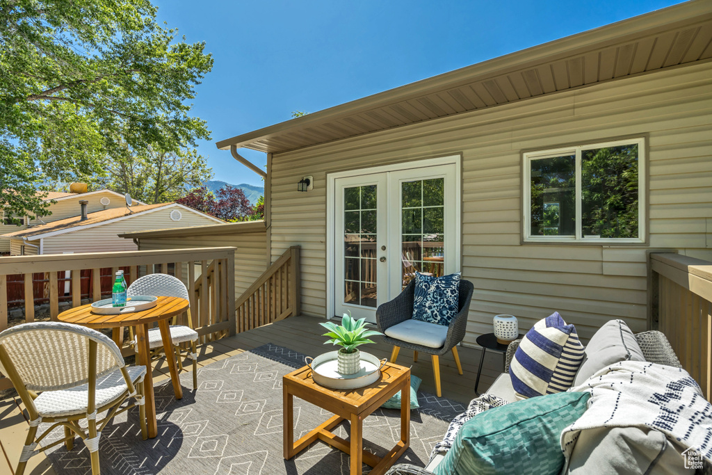 View of patio featuring an outdoor hangout area and a deck