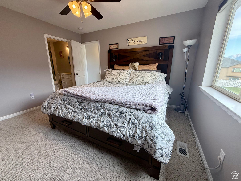 Bedroom with carpet flooring and ceiling fan