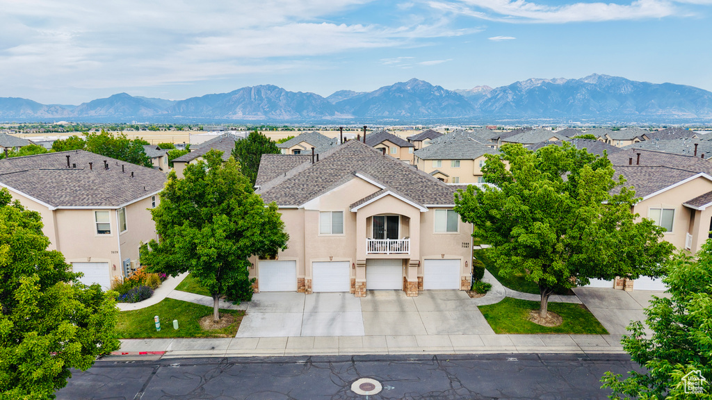 View of mountain backdrop featuring nearby suburban area