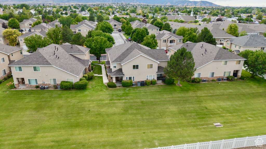 Aerial perspective of suburban area with a mountain backdrop