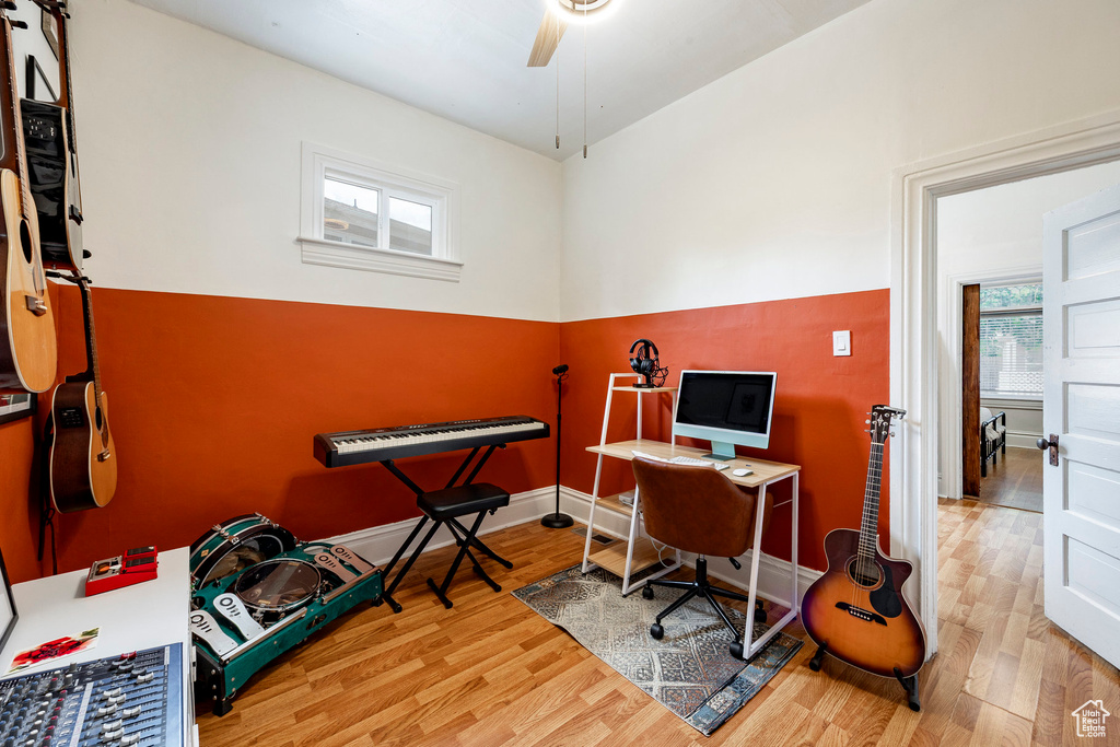 Home office featuring wood finished floors and ceiling fan
