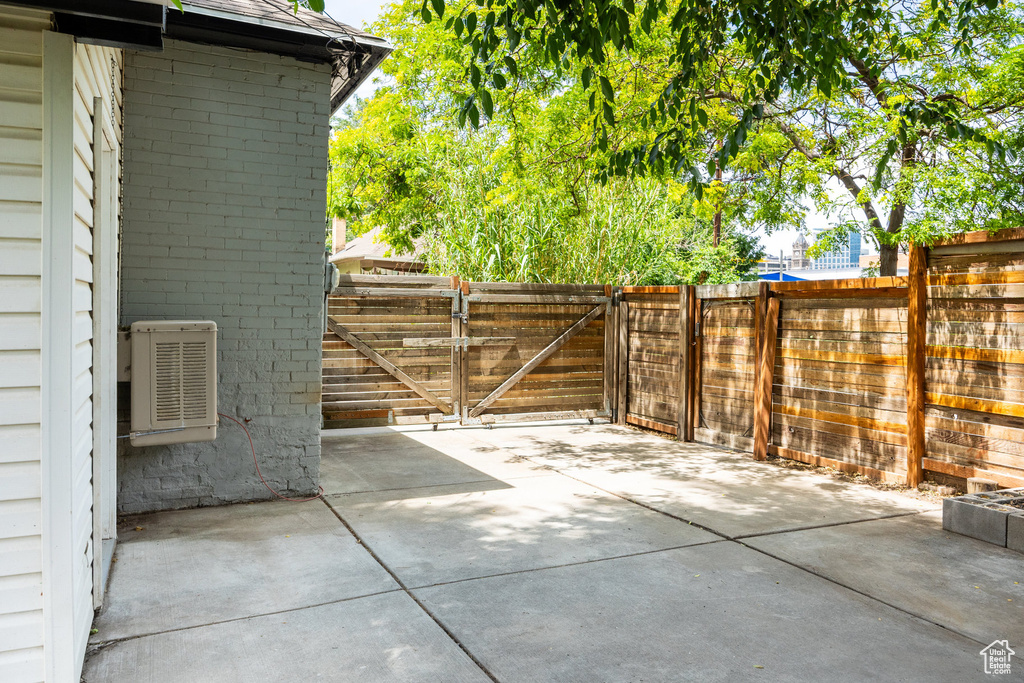 View of patio featuring a gate