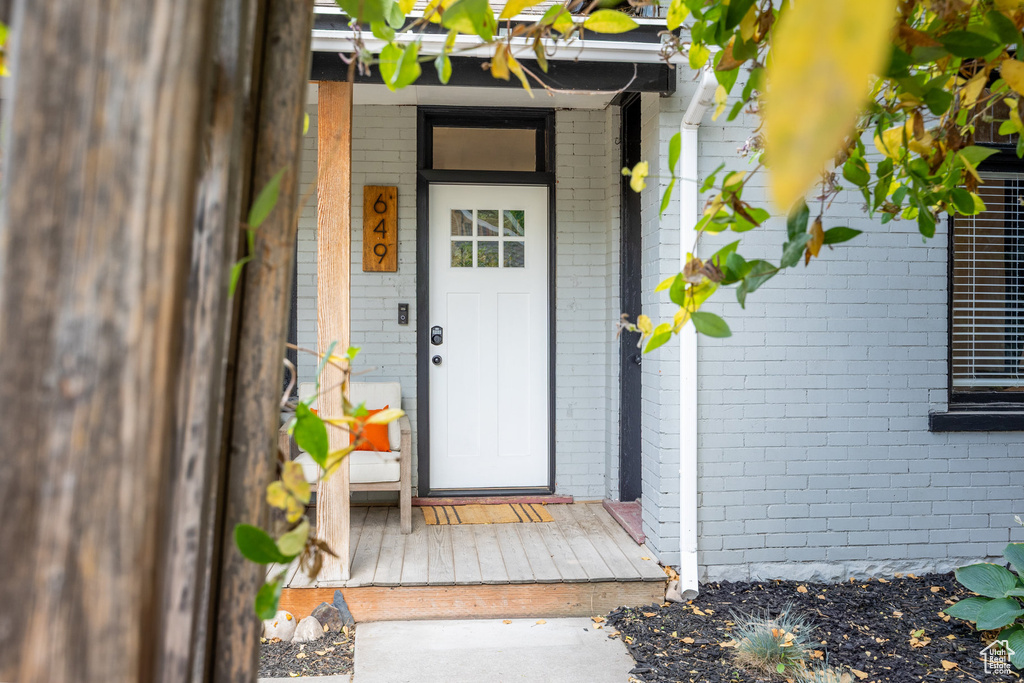Entrance to property with brick siding