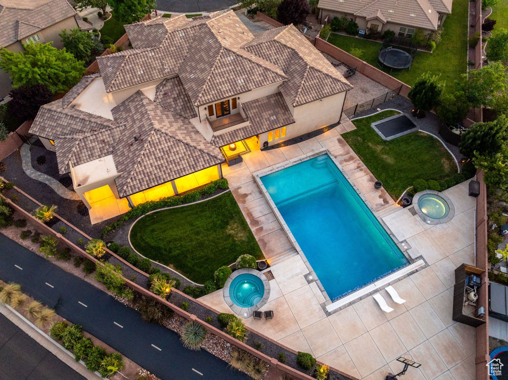 View of subject property with a pool