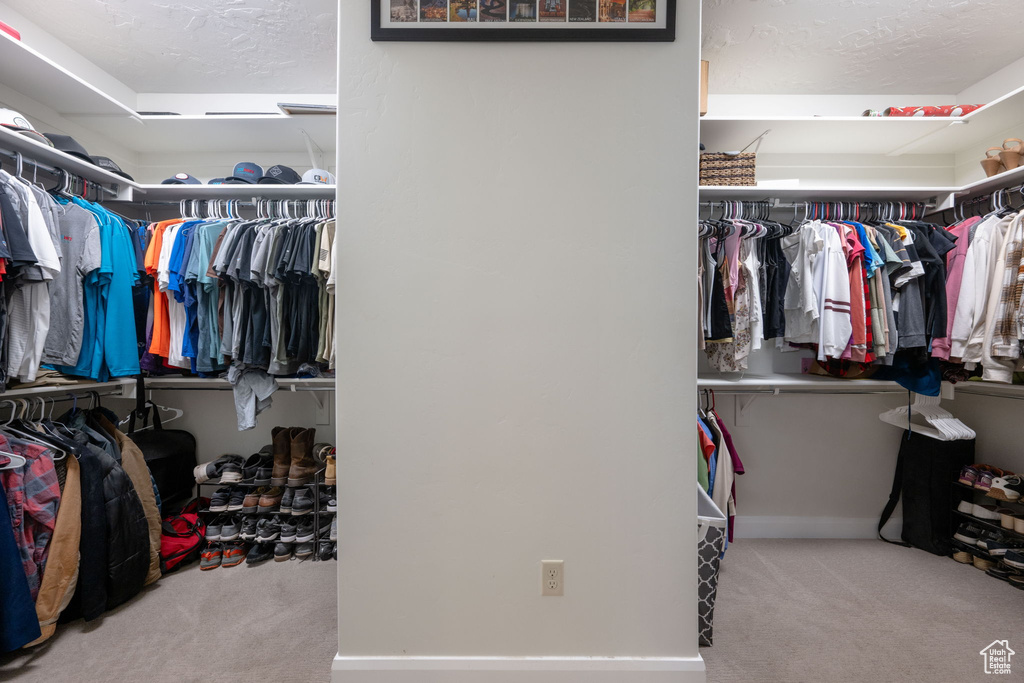 Spacious closet with carpet flooring