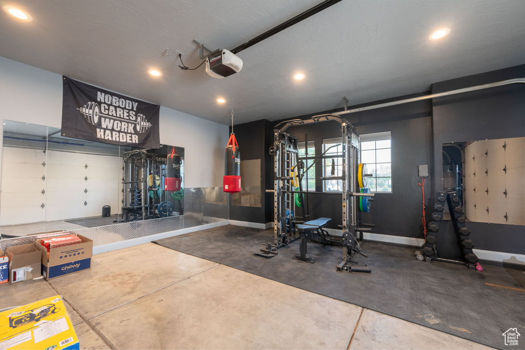 Garage with a garage door opener and recessed lighting