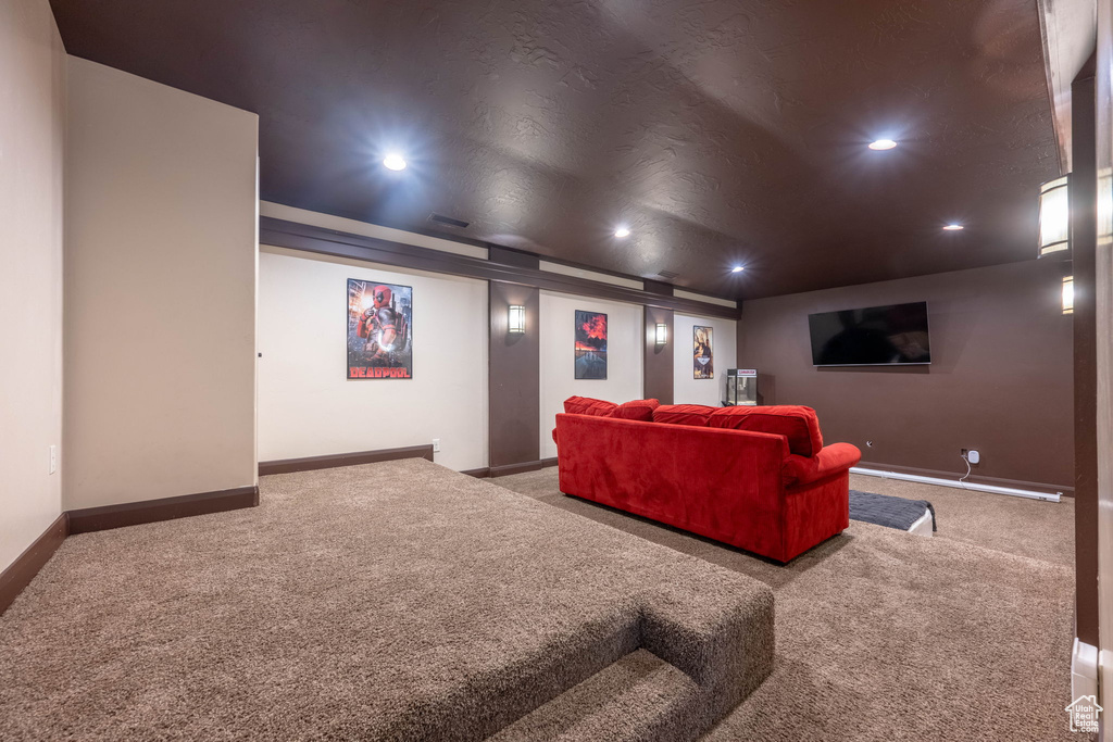 Carpeted cinema with recessed lighting