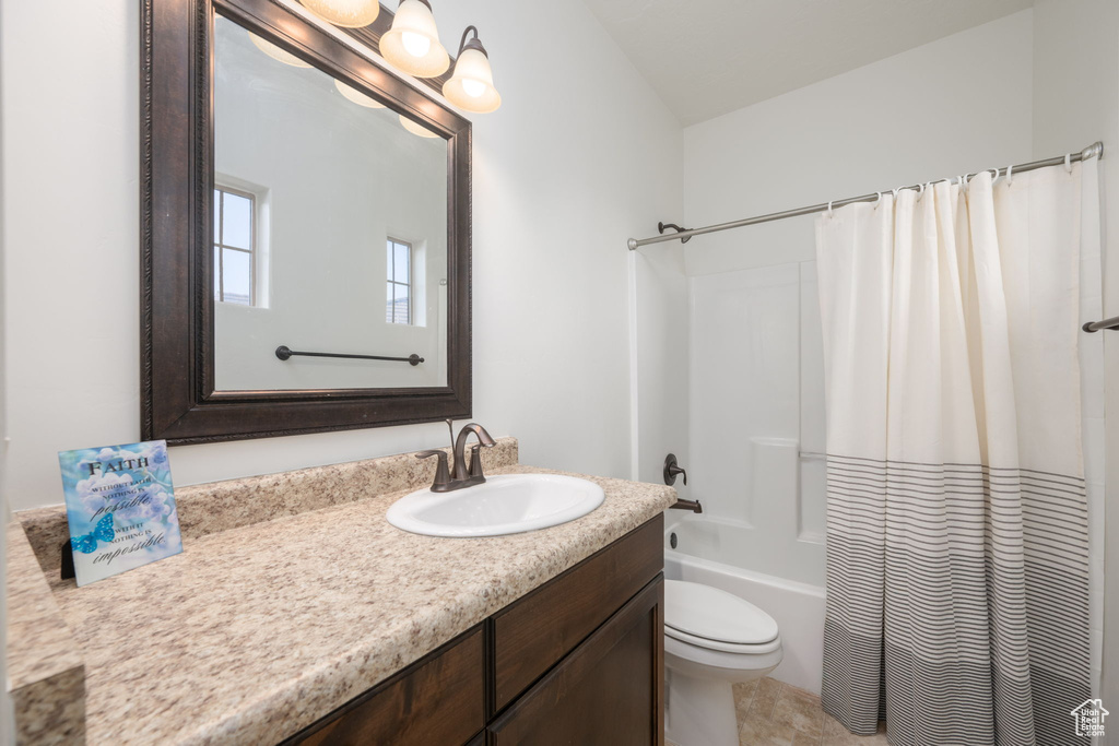 Full bath featuring vanity and shower / bathtub combination with curtain