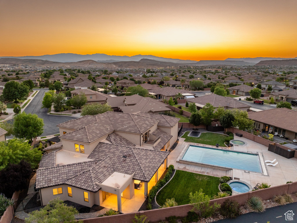 Aerial view of residential area featuring mountains