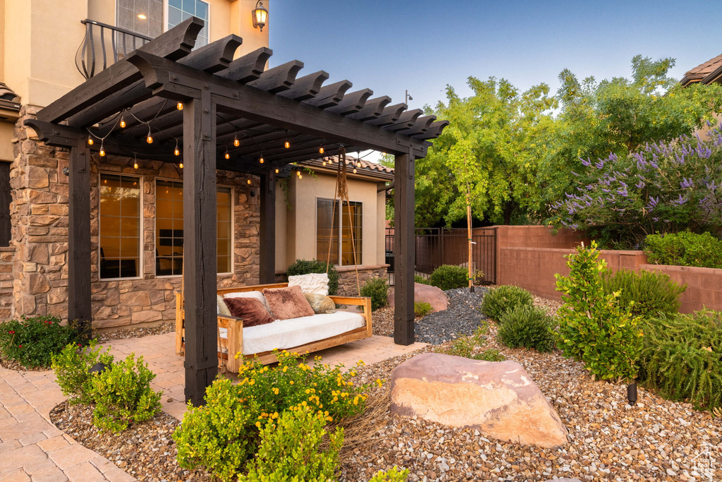 View of patio / terrace featuring a pergola and an outdoor living space
