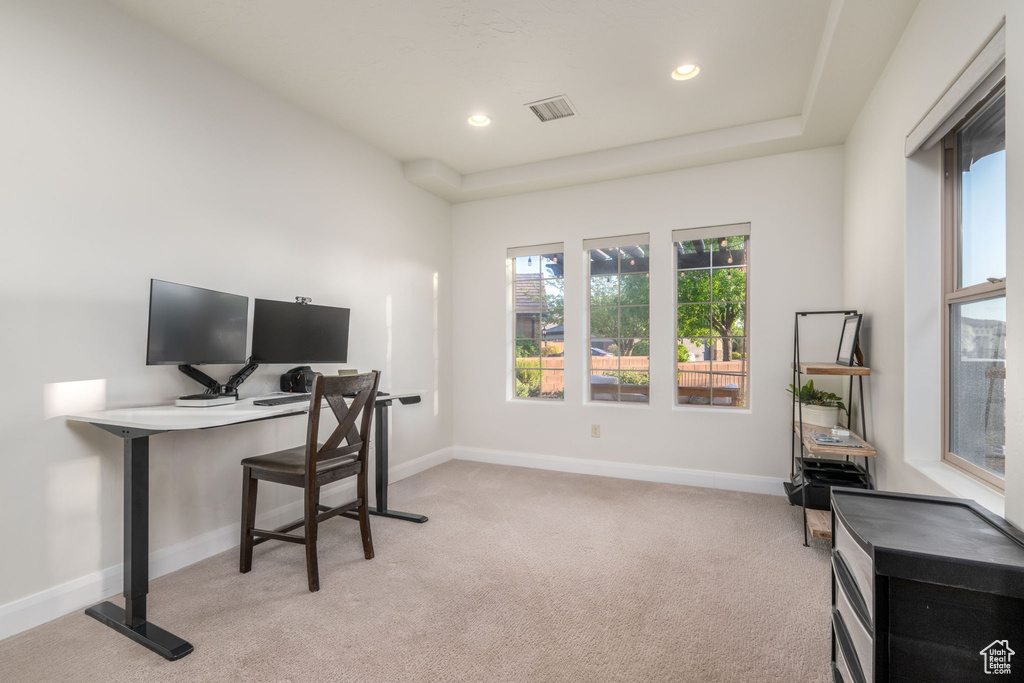Office space featuring light colored carpet and recessed lighting