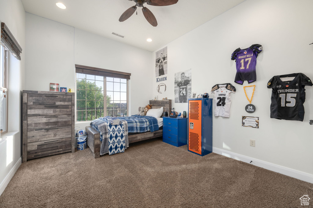 Carpeted bedroom with recessed lighting and a ceiling fan