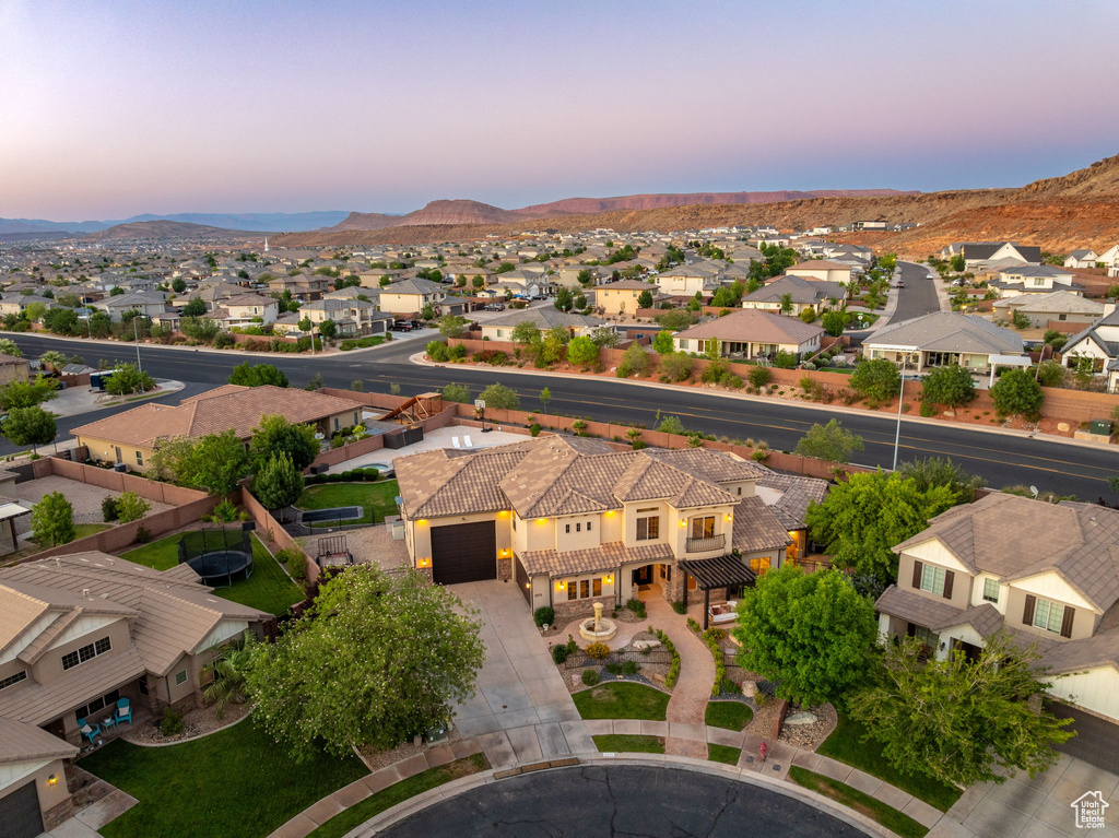 Aerial view of residential area featuring mountains