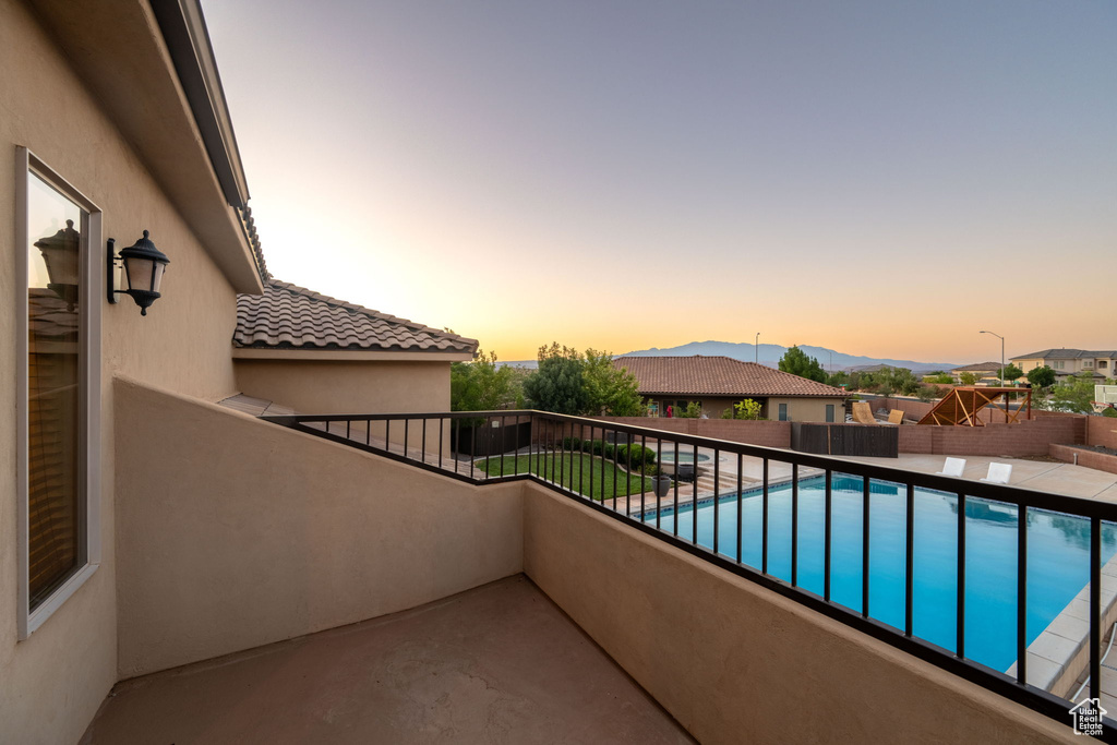 Balcony featuring view of pool and a mountain view