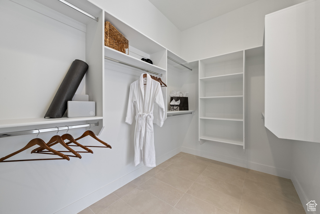 Spacious closet with light tile patterned flooring