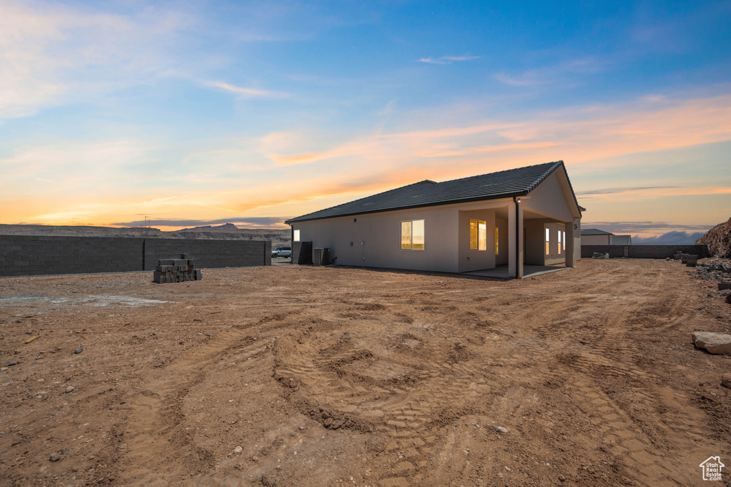 Back of property with stucco siding