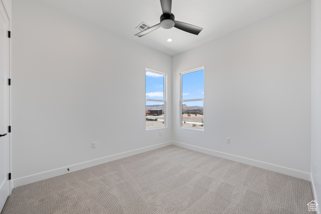 Spare room with light carpet, a ceiling fan, and recessed lighting