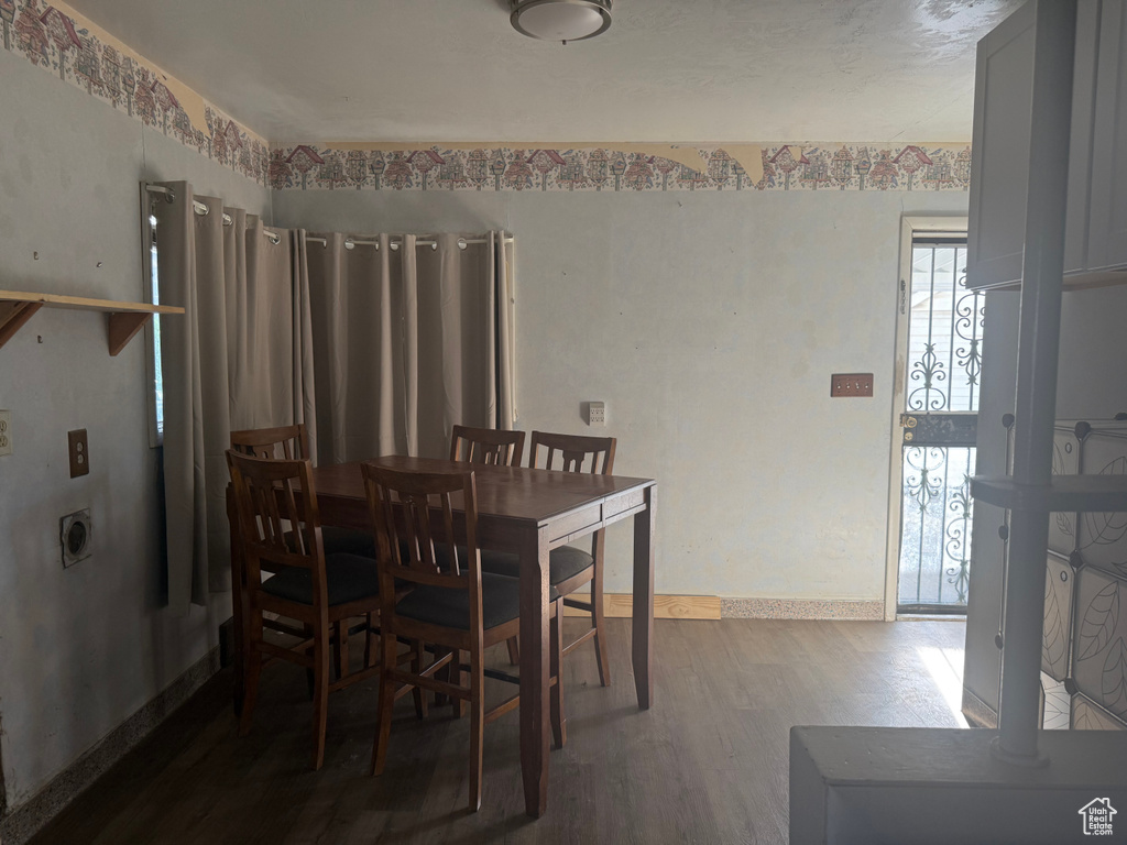 Dining area featuring wood finished floors