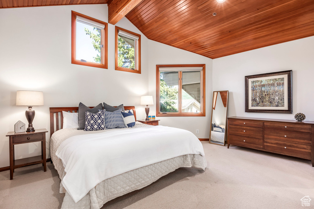 Bedroom featuring wood ceiling and light colored carpet