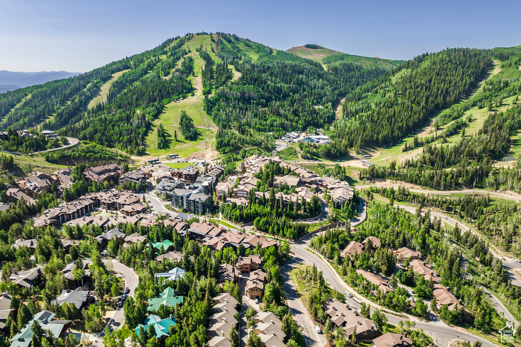 Aerial perspective of suburban area featuring a mountainous background