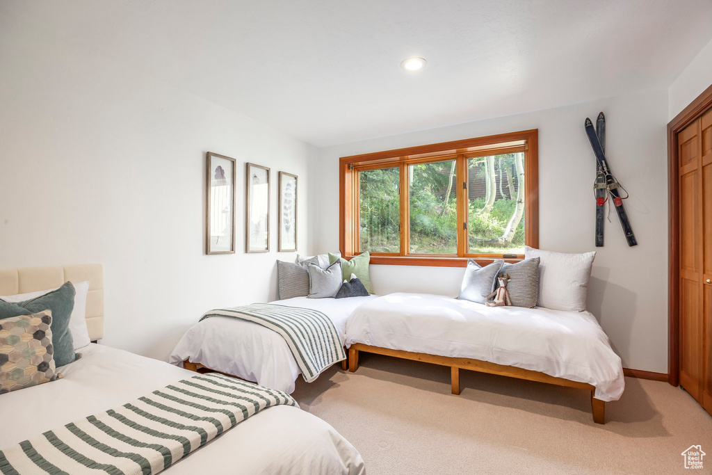 Carpeted bedroom featuring recessed lighting