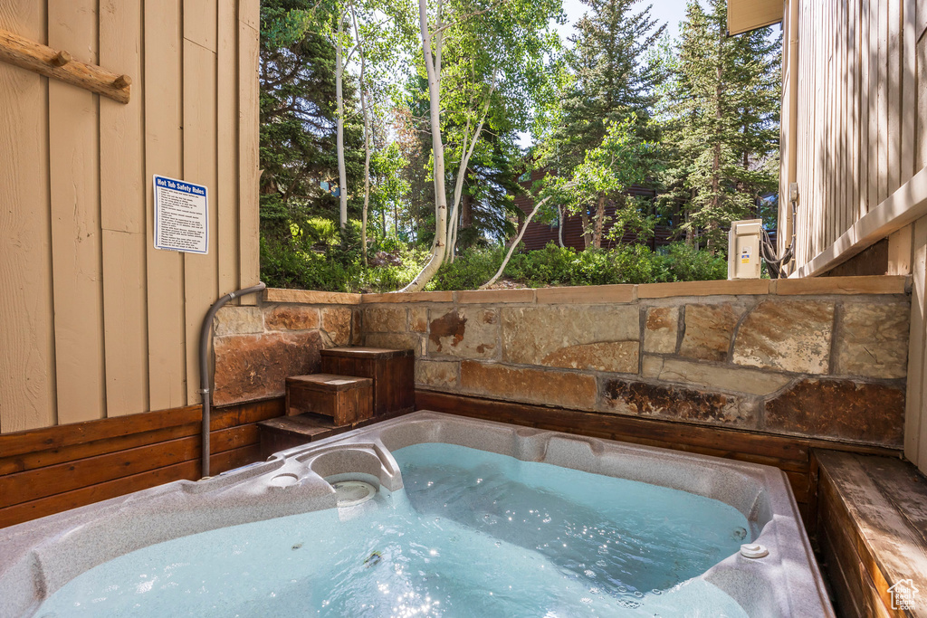 View of pool featuring a hot tub