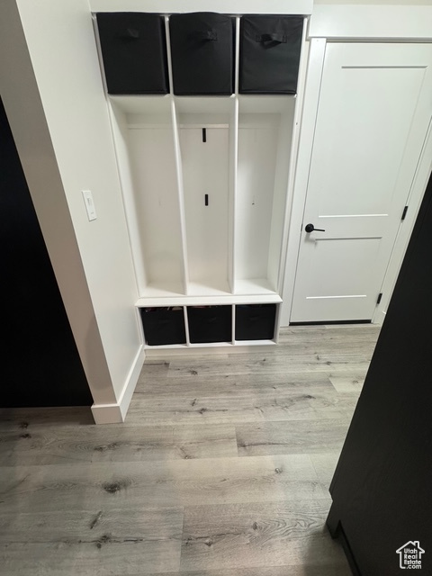 Mudroom with light wood-style flooring